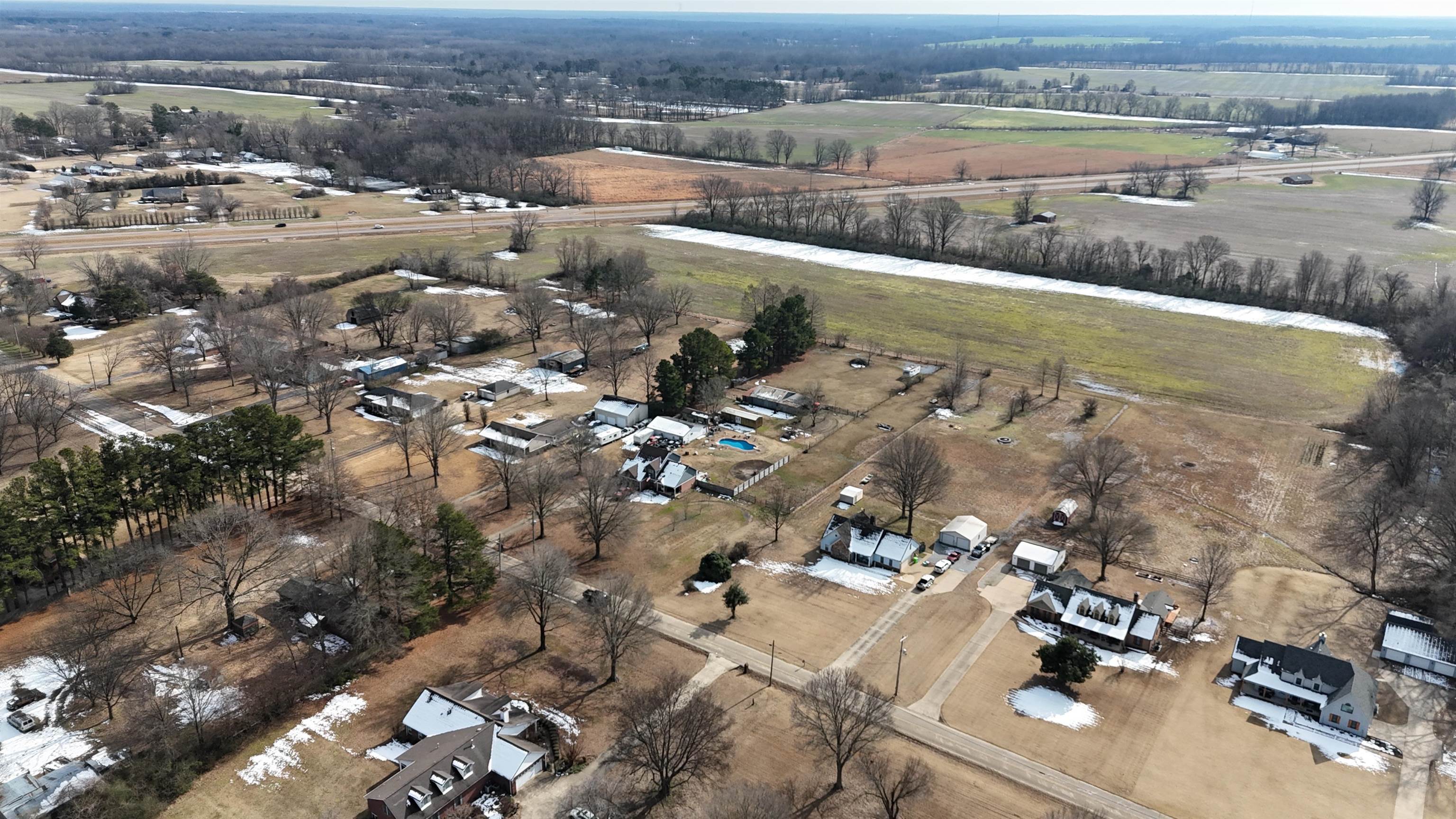 an aerial view of residential houses with outdoor space