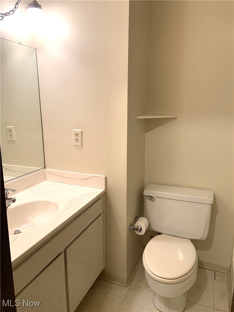 9956 Johnnycake Ridge Road, Unit D9 Painesville, OH 44077 - Photo 25 of 37 Bathroom featuring vanity and light tile patterned floors