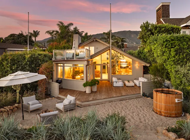 a view of a chairs and table in the patio