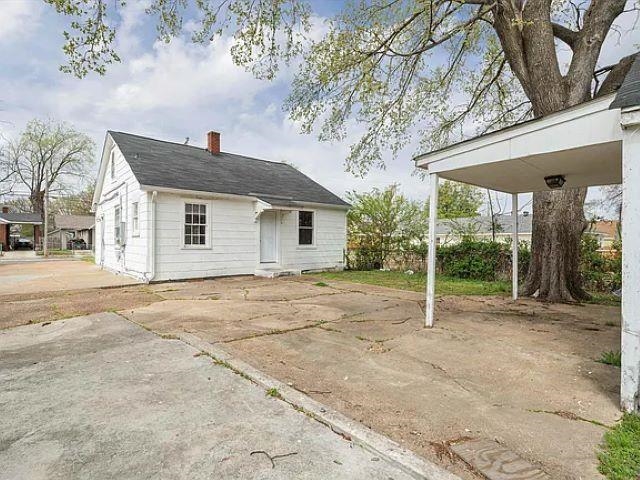 778 North Merton Street Memphis, TN 38112 - Photo 15 of 15 a backyard of a house with garden and outdoor seating