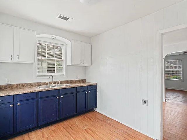 778 North Merton Street Memphis, TN 38112 - Photo 8 of 15 a kitchen with stainless steel appliances granite countertop a sink and wooden cabinets with wooden floor