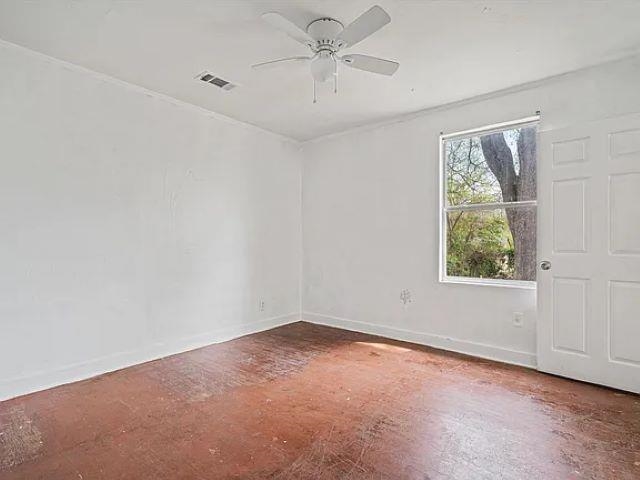 778 North Merton Street Memphis, TN 38112 - Photo 9 of 15 an empty room with a window and a fan