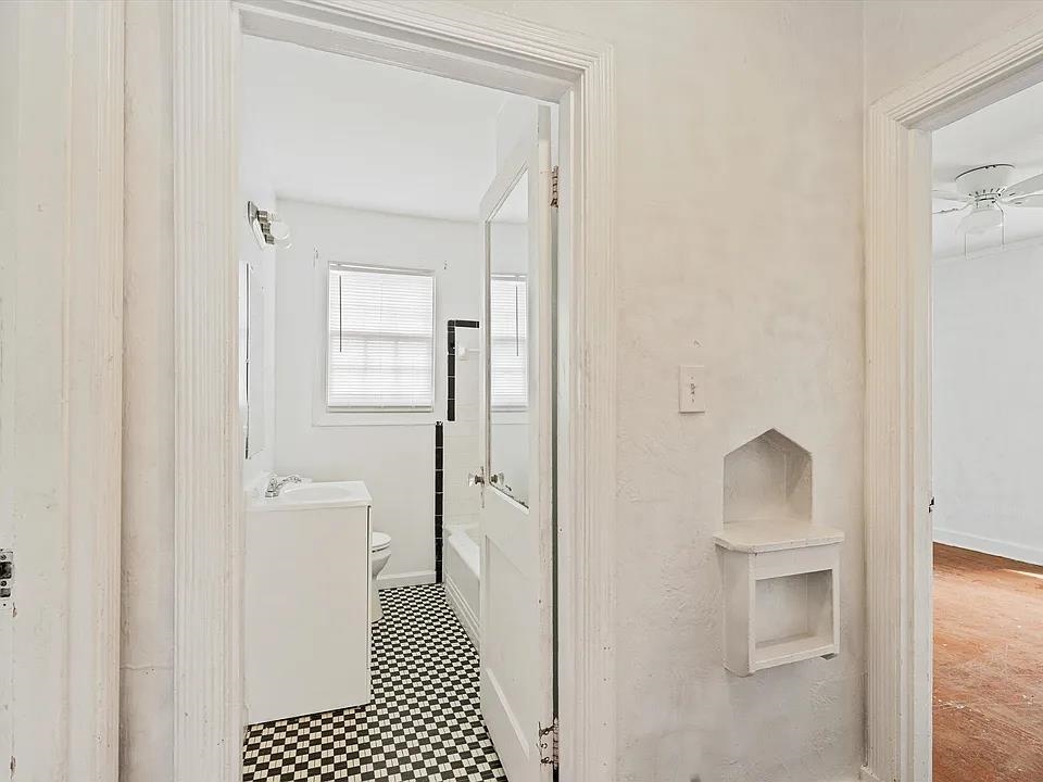 778 North Merton Street Memphis, TN 38112 - Photo 10 of 15 a bathroom with a sink and a mirror