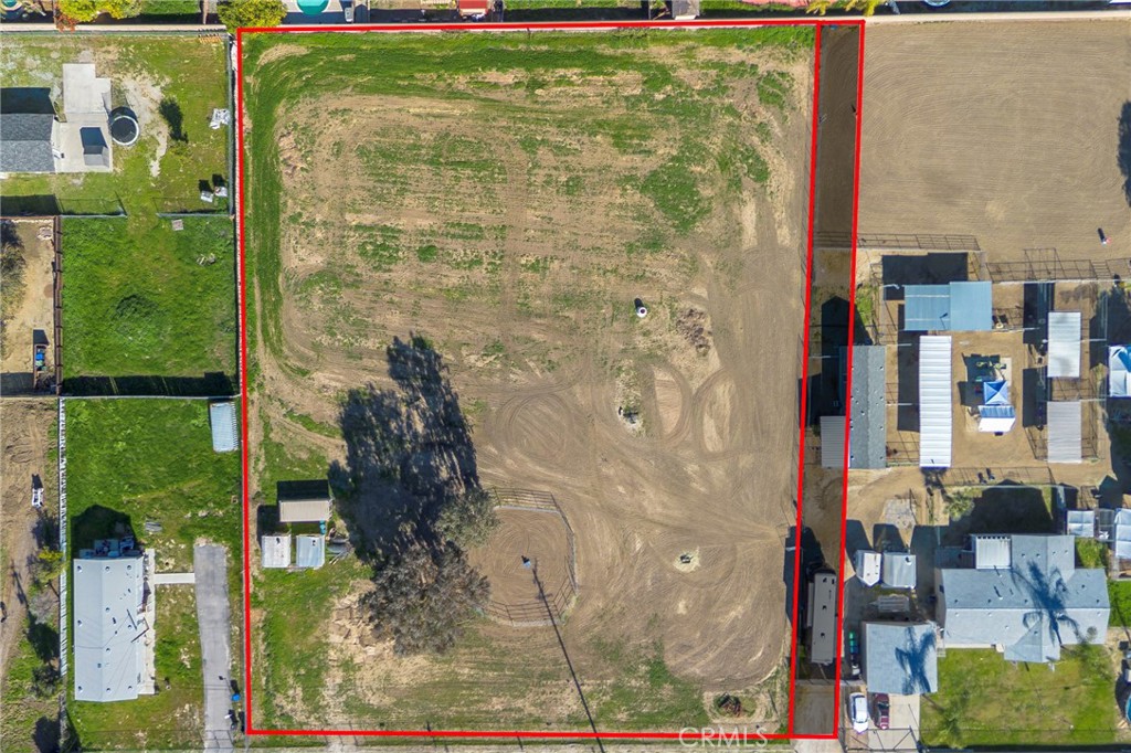 0 Palm Hemet, CA 92544 - Photo 3 of 6 a aerial view of a residential apartment building with a yard and large trees