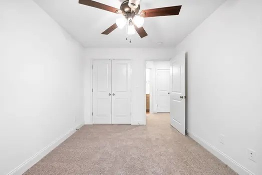 940 Britton Springs Road, Unit 605 Clarksville, TN 37042 - Photo 27 of 30 an empty room with chandelier fan and windows