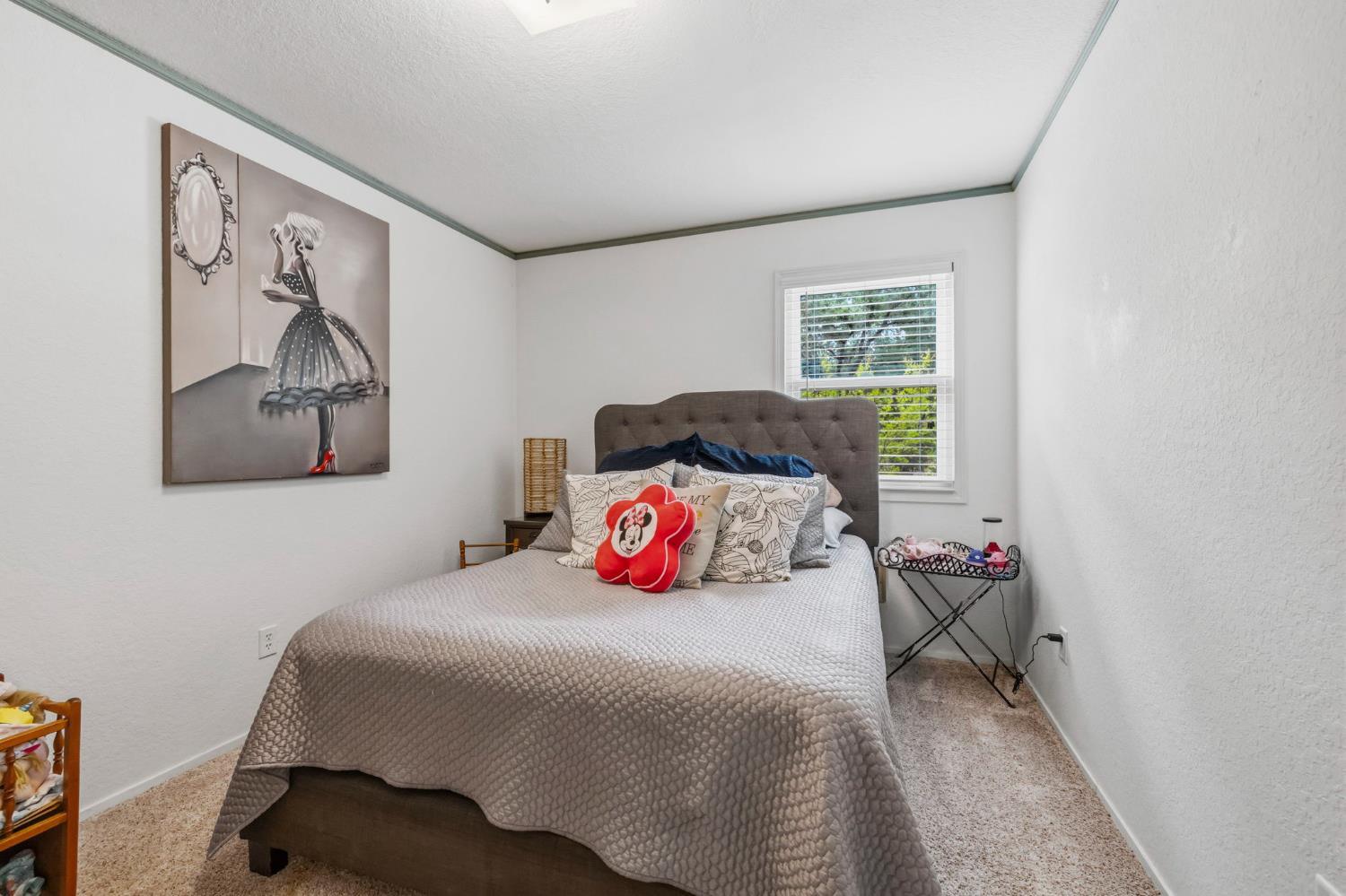 11460 Racetrack Road Sonora, CA 95370 - Photo 26 of 46 a bedroom with a bed and dresser