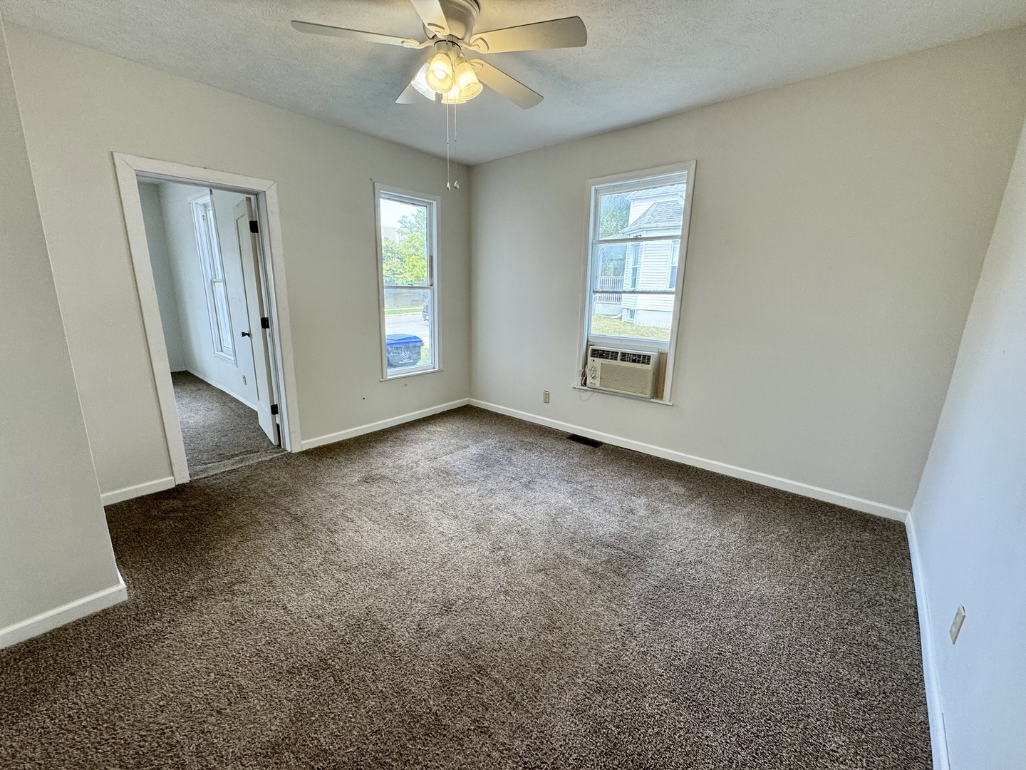 304 South Prairie Street Bloomington, IL 61701 - Photo 11 of 34 an empty room with windows and fan