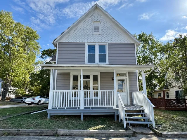 a view of a house with wooden deck