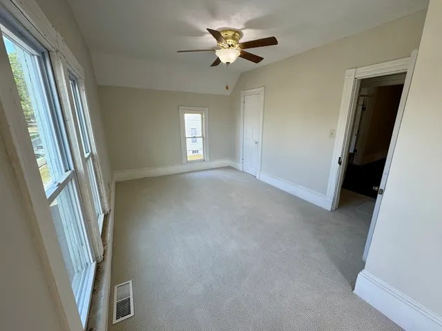 a view of an empty room with a window