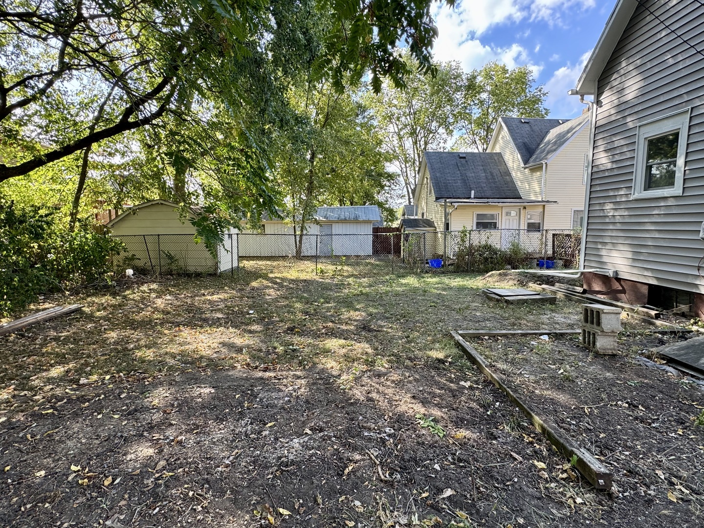 304 South Prairie Street Bloomington, IL 61701 - Photo 34 of 34 a view of a house with a yard and sitting area