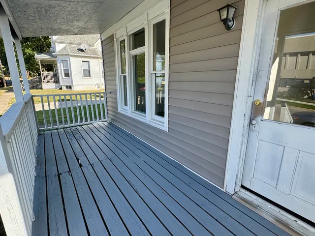 a view of a house with wooden deck