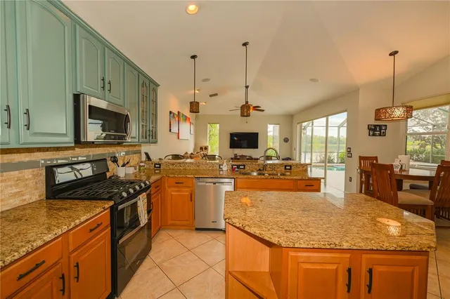 a view of a dining room with furniture window and outside view