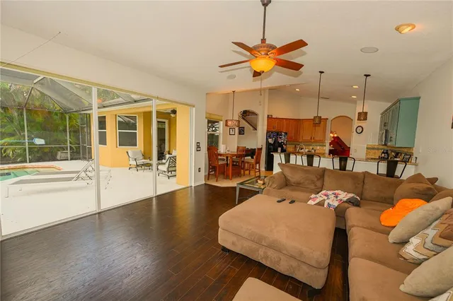 a view of swimming pool with a patio and a yard