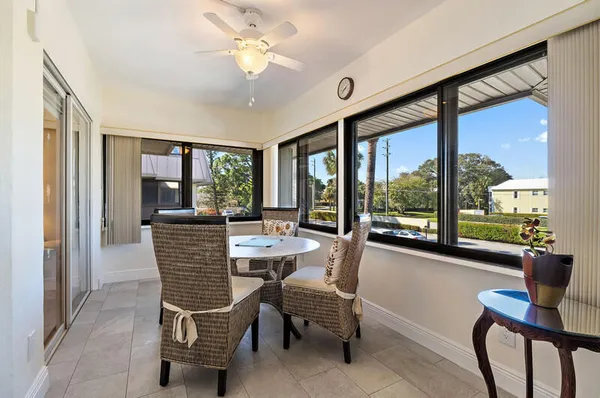 a spacious bedroom with a bed and a chandelier