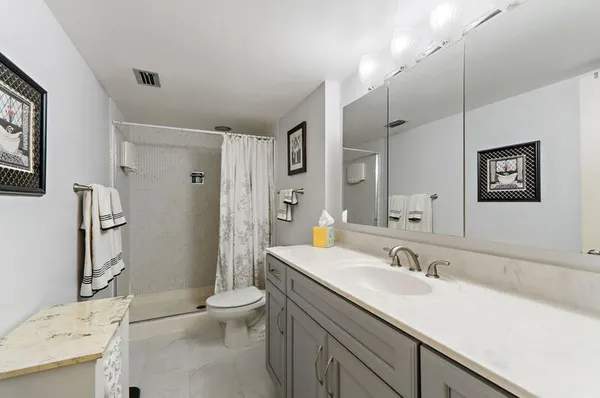 a close view of a utility room with dryer and washer