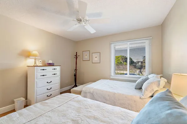 a large kitchen with stainless steel appliances granite countertop a sink stove and refrigerator