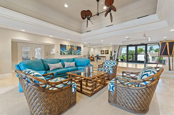 a view of a house with backyard and sitting area