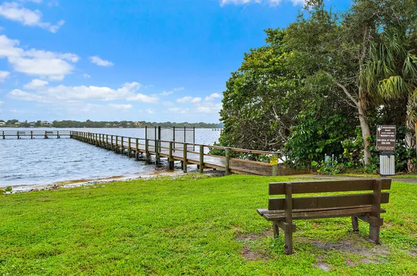 a view of wooden floor with a bench
