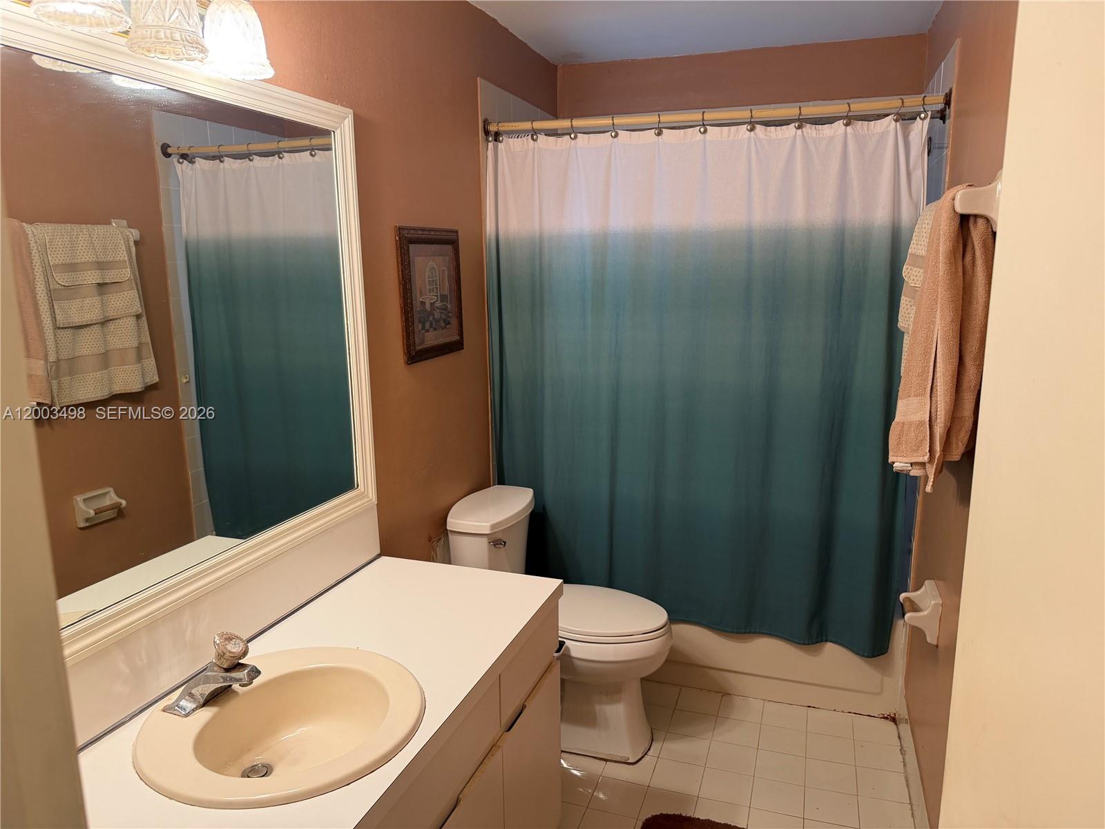 6010 Northwest 201st Lane Hialeah, FL 33015 - Photo 22 of 36 a bathroom with a sink a toilet and shower