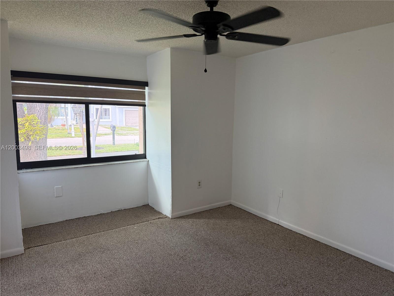 6010 Northwest 201st Lane Hialeah, FL 33015 - Photo 23 of 36 a view of an empty room with a window
