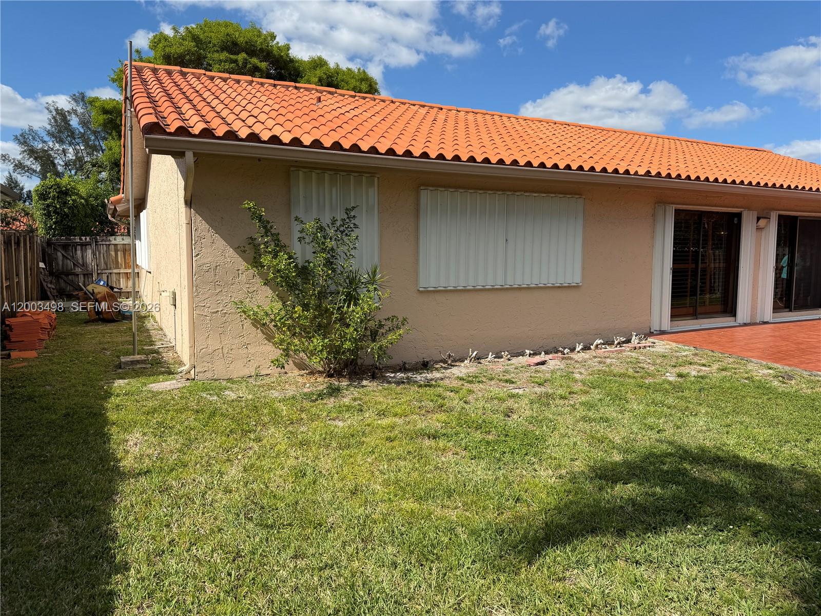 6010 Northwest 201st Lane Hialeah, FL 33015 - Photo 35 of 36 a house with garden
