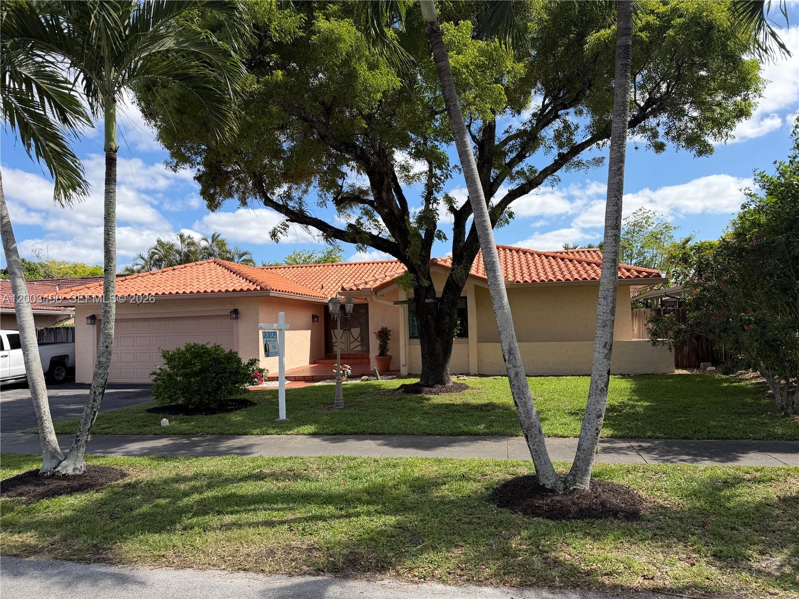 6010 Northwest 201st Lane Hialeah, FL 33015 - Photo 6 of 36 a view of a house with a yard