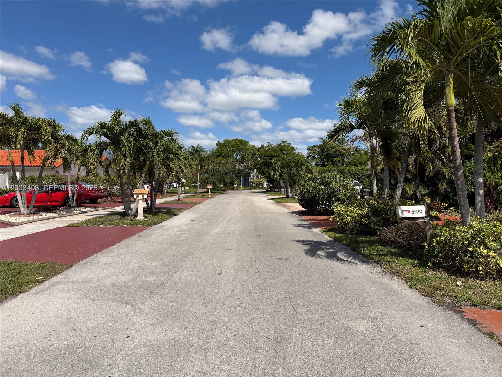 6010 Northwest 201st Lane Hialeah, FL 33015 - Photo 10 of 36 a view of a street with houses