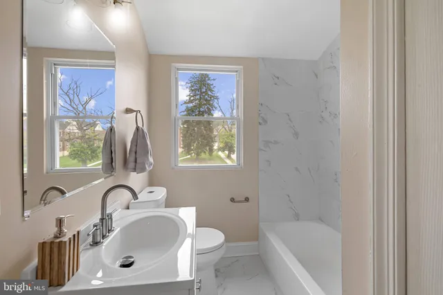 a bathroom with a sink and a bathtub