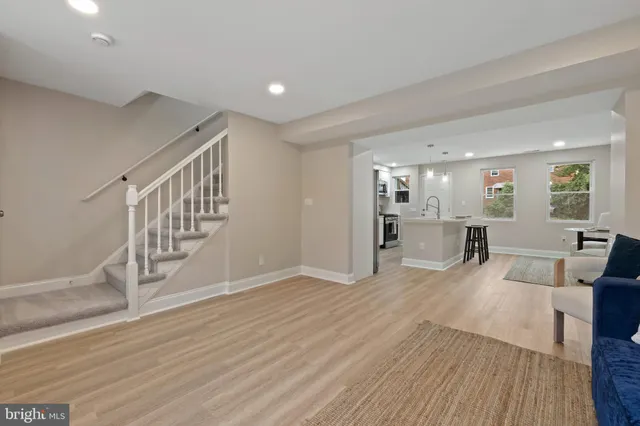 a view of kitchen with furniture and wooden floor