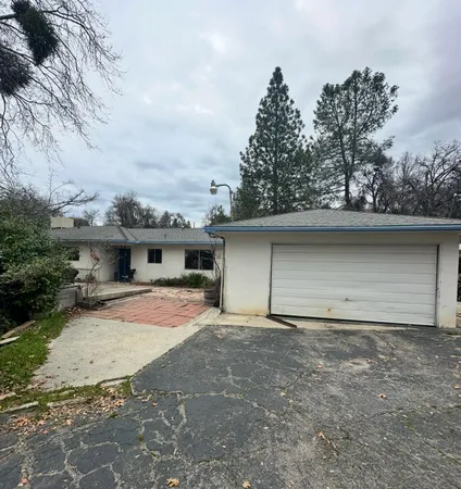a front view of a house with yard