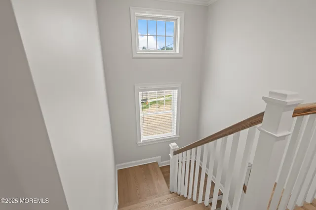 a view of entryway with window and stairs
