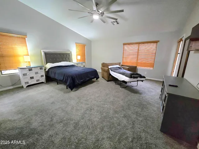 a bed room with a bed and a window