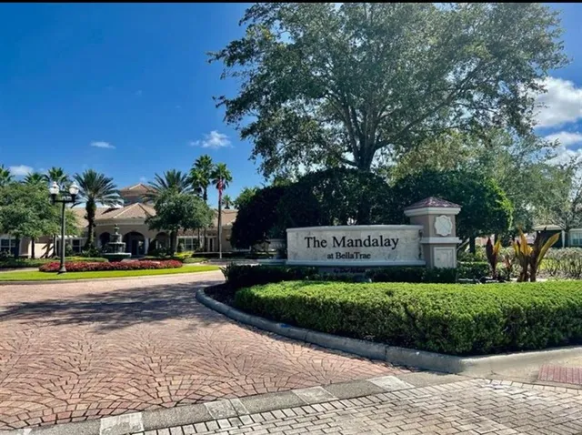 a front view of a multi story residential apartment building with a yard