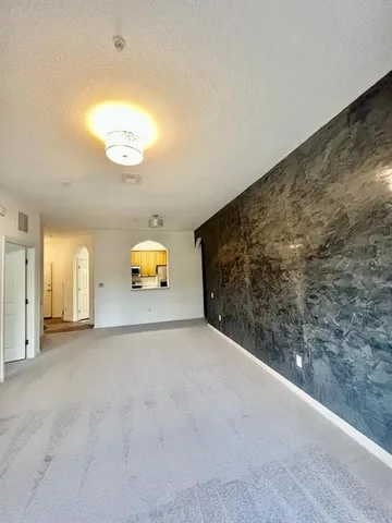 a view of a big room with windows