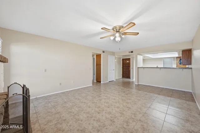 a view of a big room with a kitchen