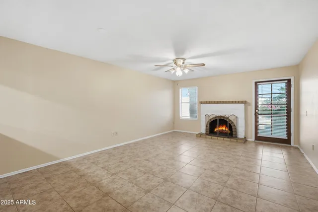 a view of an empty room with a fireplace