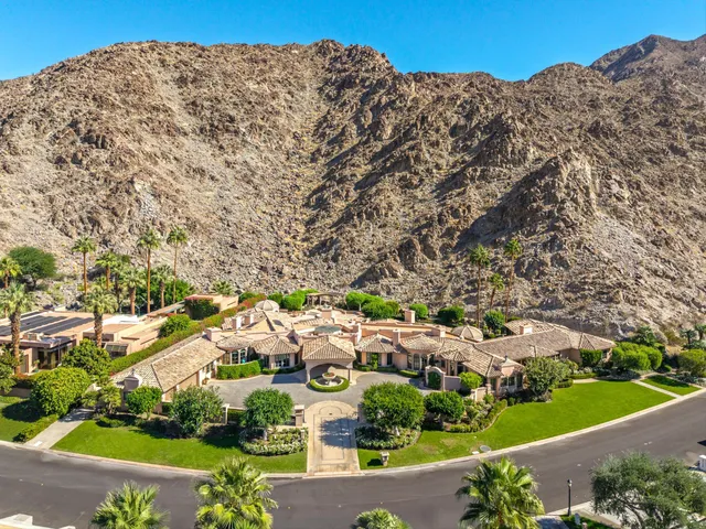 a view of a swimming pool with a yard