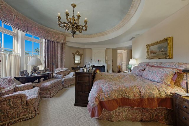 a view of a patio with table and chairs potted plants