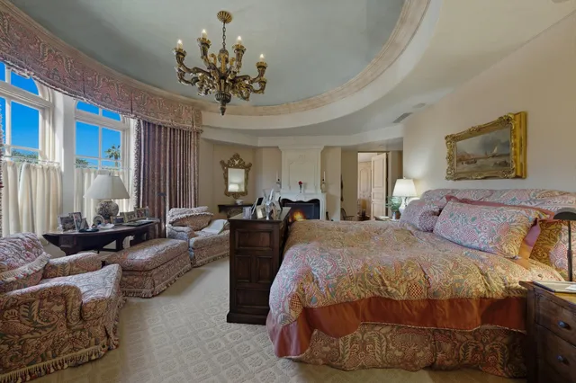 a view of a patio with table and chairs potted plants