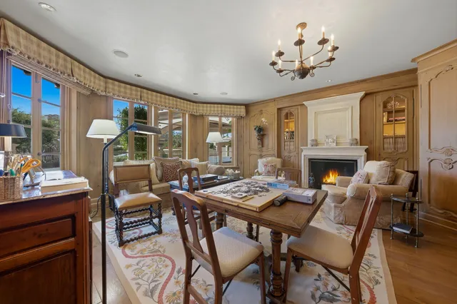 a view of a house with garden and sitting area