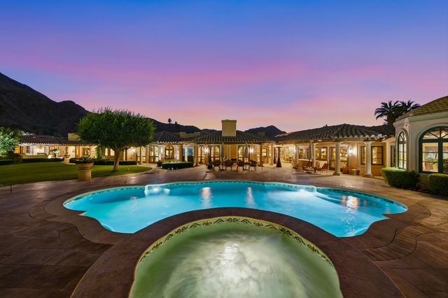 a bathroom with a sink double vanity and a mirror