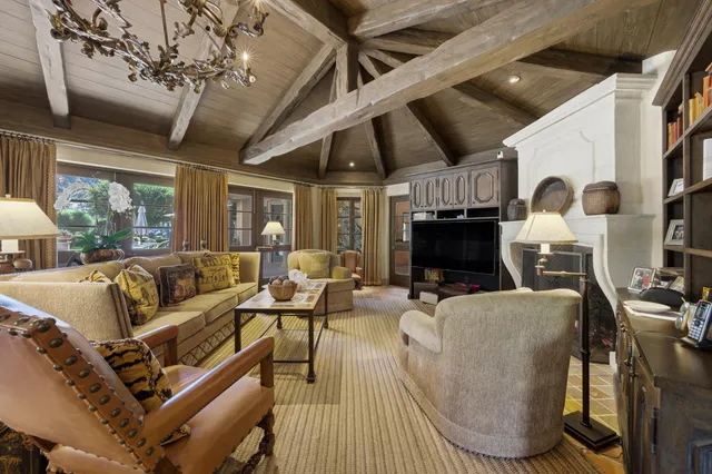 a view of a backyard with plants and lake view