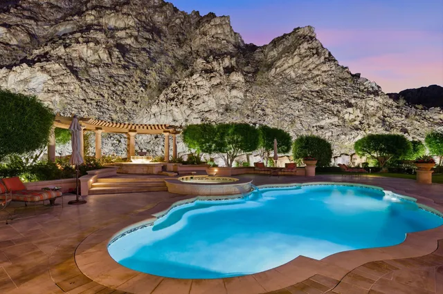 a view of a dining room with furniture and a fireplace