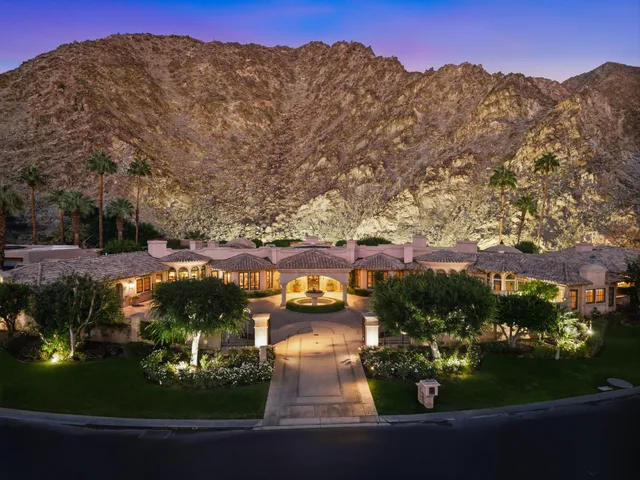 a bedroom with furniture and a chandelier