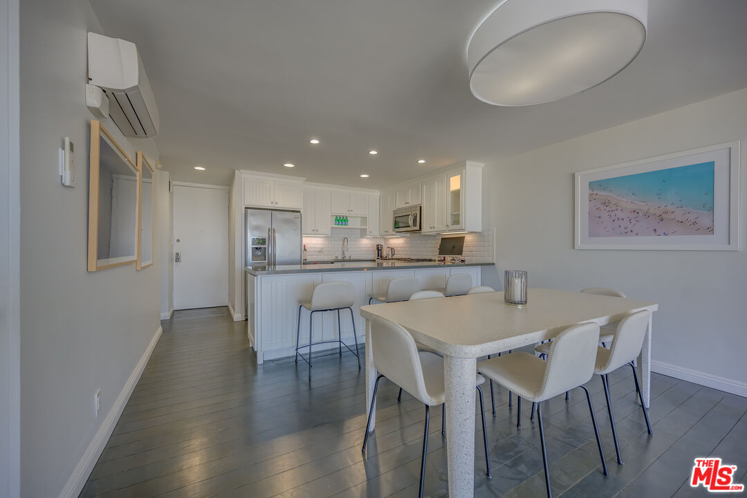 2 Ketch Street, Unit 107 Marina del Rey, CA 90292 - Photo 11 of 22 a view of a dining room with furniture and wooden floor