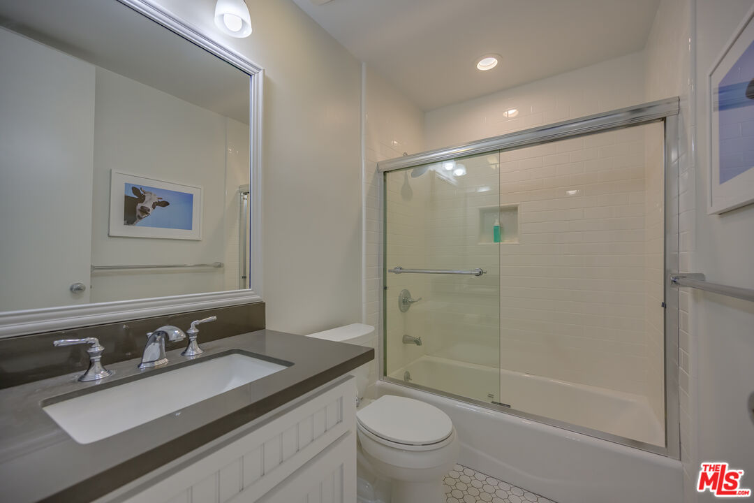 2 Ketch Street, Unit 107 Marina del Rey, CA 90292 - Photo 20 of 22 a bathroom with a sink a toilet and shower