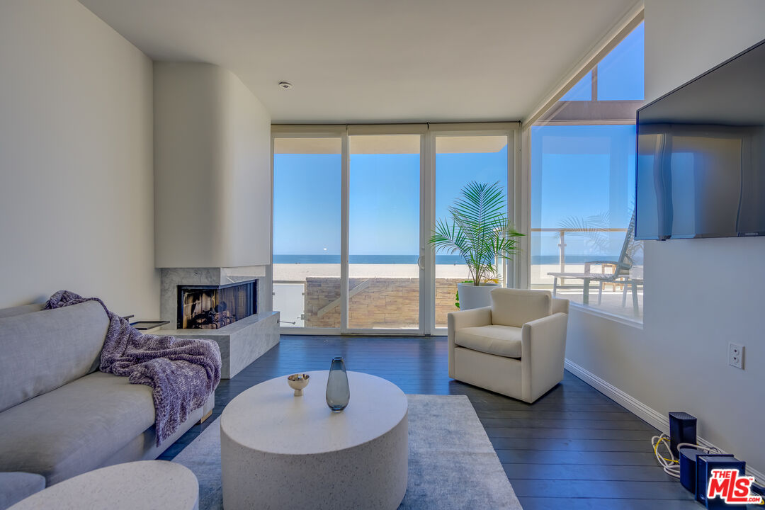 2 Ketch Street, Unit 107 Marina del Rey, CA 90292 - Photo 5 of 22 a living room with furniture and a large window
