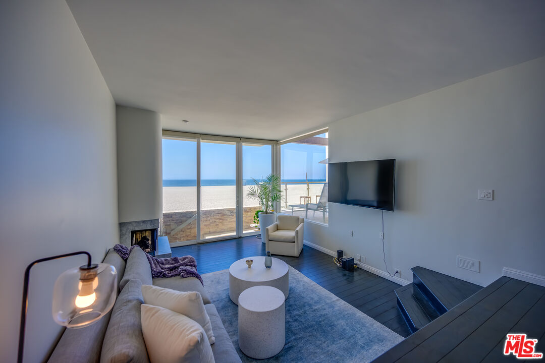2 Ketch Street, Unit 107 Marina del Rey, CA 90292 - Photo 6 of 22 a living room with furniture and a flat screen tv