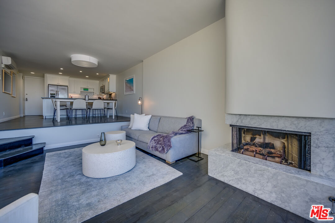2 Ketch Street, Unit 107 Marina del Rey, CA 90292 - Photo 10 of 22 a living room with furniture and a fireplace