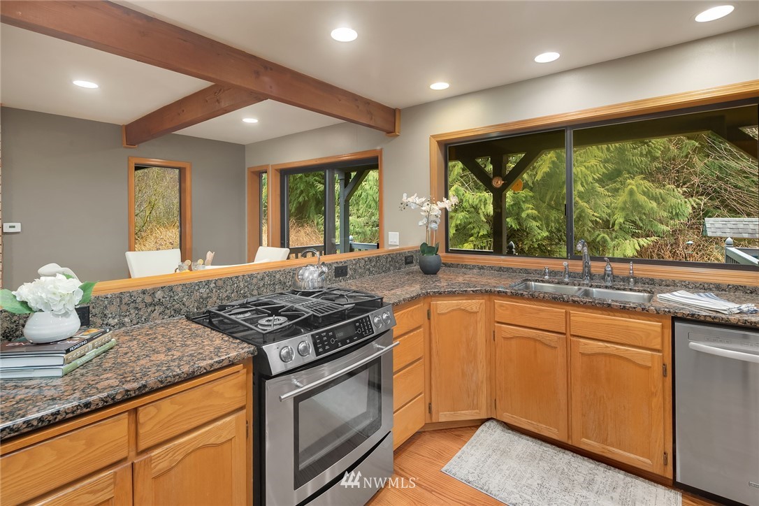 820 Carlson Road Snohomish, WA 98290 - Photo 11 of 39 a kitchen with stainless steel appliances granite countertop sink stove and refrigerator